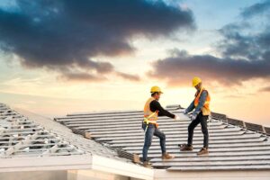 A residential rooftop with visible sun fading and minor shingle curling on a clear summer day.